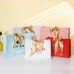 Custom Ribbon Gift Paper Bags | Luxury Printed Shopping Bags Manufacturer